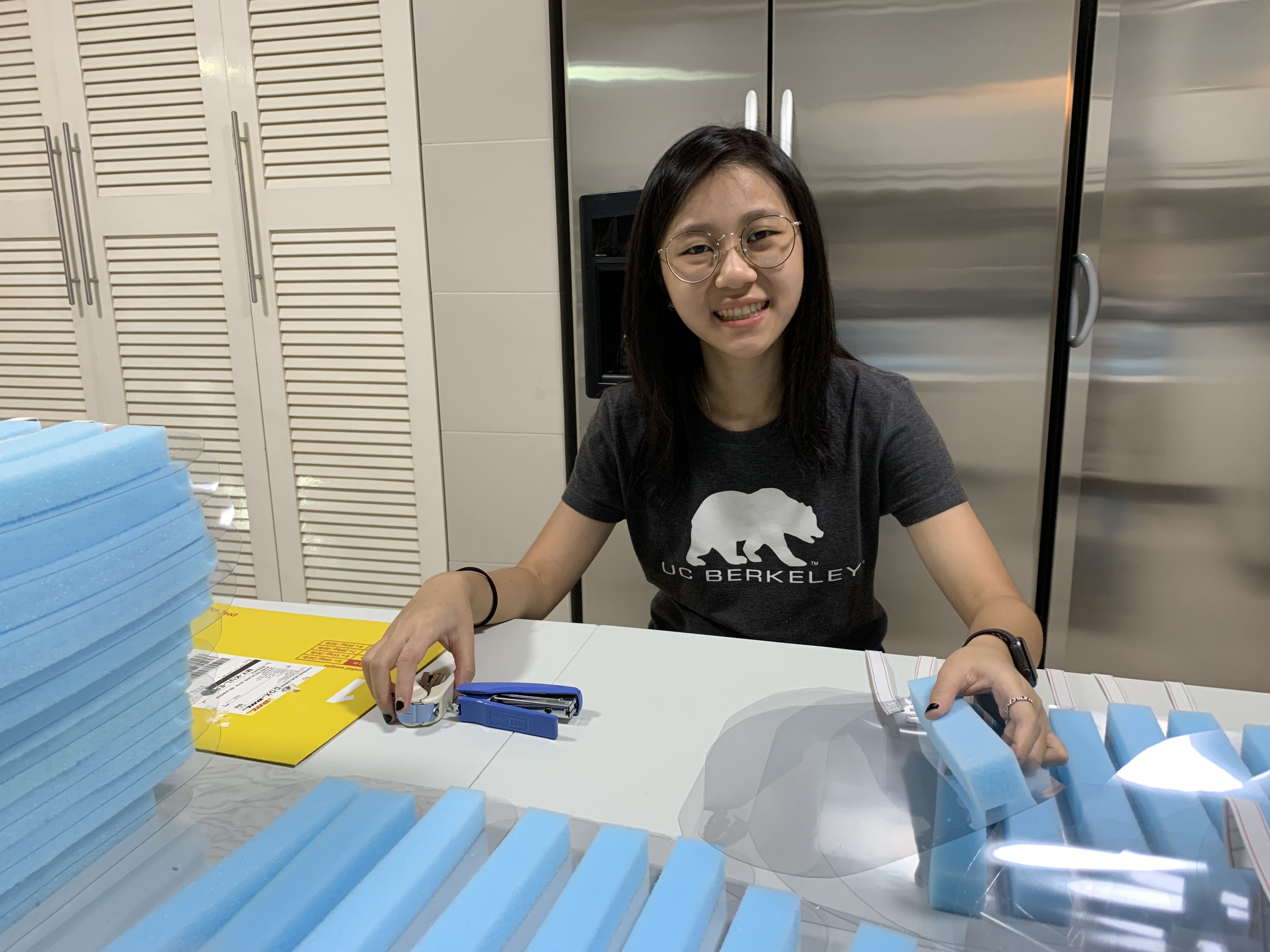 Co-founder of COVID Assist Malaysia and SJIIM student, Sandra Ong hard at work constructing the face shields needed for the frontliners